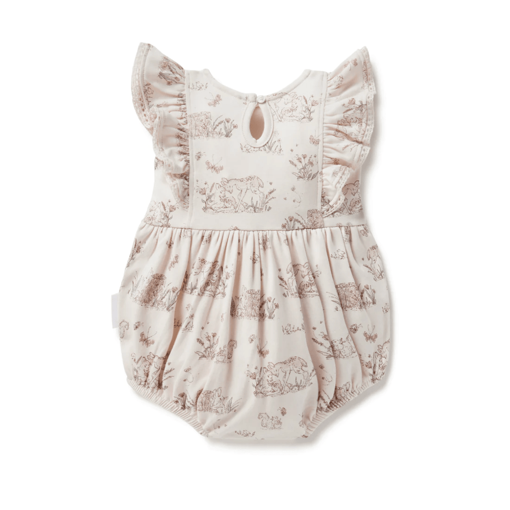 A Aster & Oak Organic Cotton Meadow Bubble Romper for babies with ruffles and an animal print.