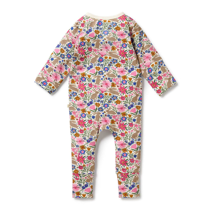 A Wilson & Frenchy Organic Baby Easter Pyjamas with flowers on it, perfect for snuggle time.