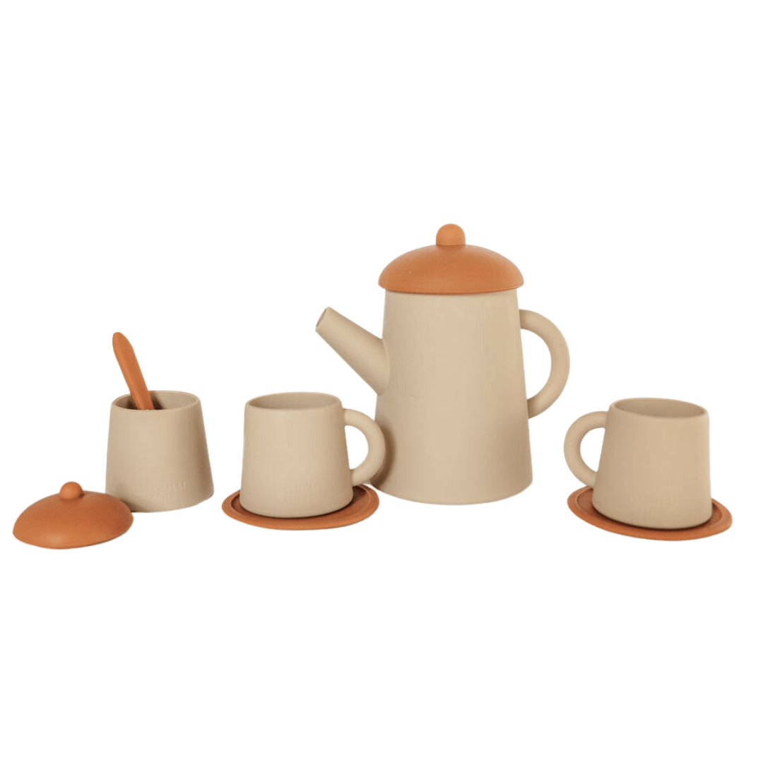 An imaginative Classical Child silicone tea set with silicone cups and saucers on a white background.