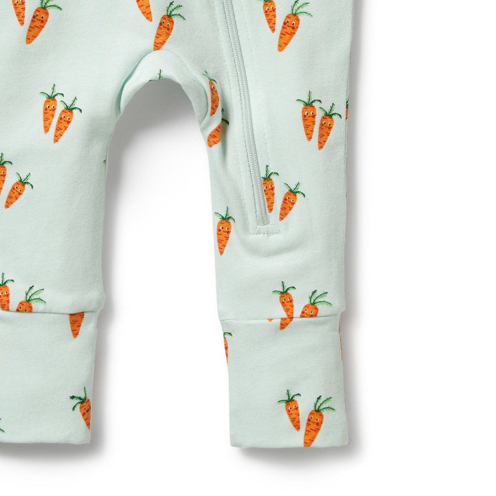 A Wilson & Frenchy Organic Baby Easter Pyjama with carrots on it.