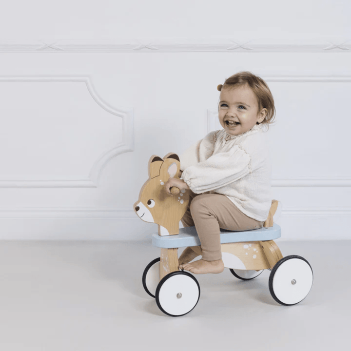 Happy-Girl-Riding-On-Le-Toy-Van-Ride-On-Deer-Naked-Baby-Eco-Boutique