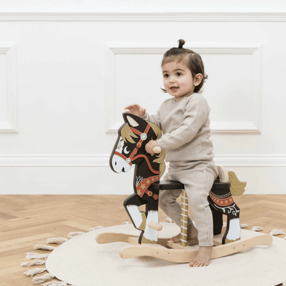Happy-Girl-Riding-On-Le-Toy-Van-Rocking-Horse-Naked-Baby-Eco-Boutique