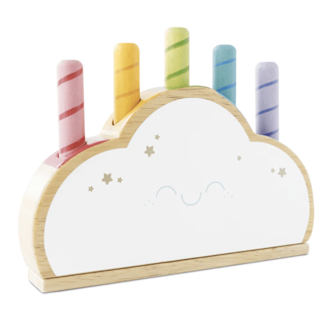 An eco-friendly Le Toy Van Rainbow Pop Cloud with a rainbow of candles on top.