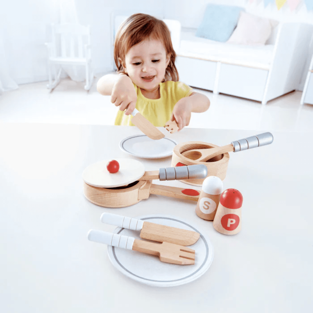 Little-Girl-Playing-With-Hape-Cook-And-Serve-Set-Naked-Baby-Eco-Boutique