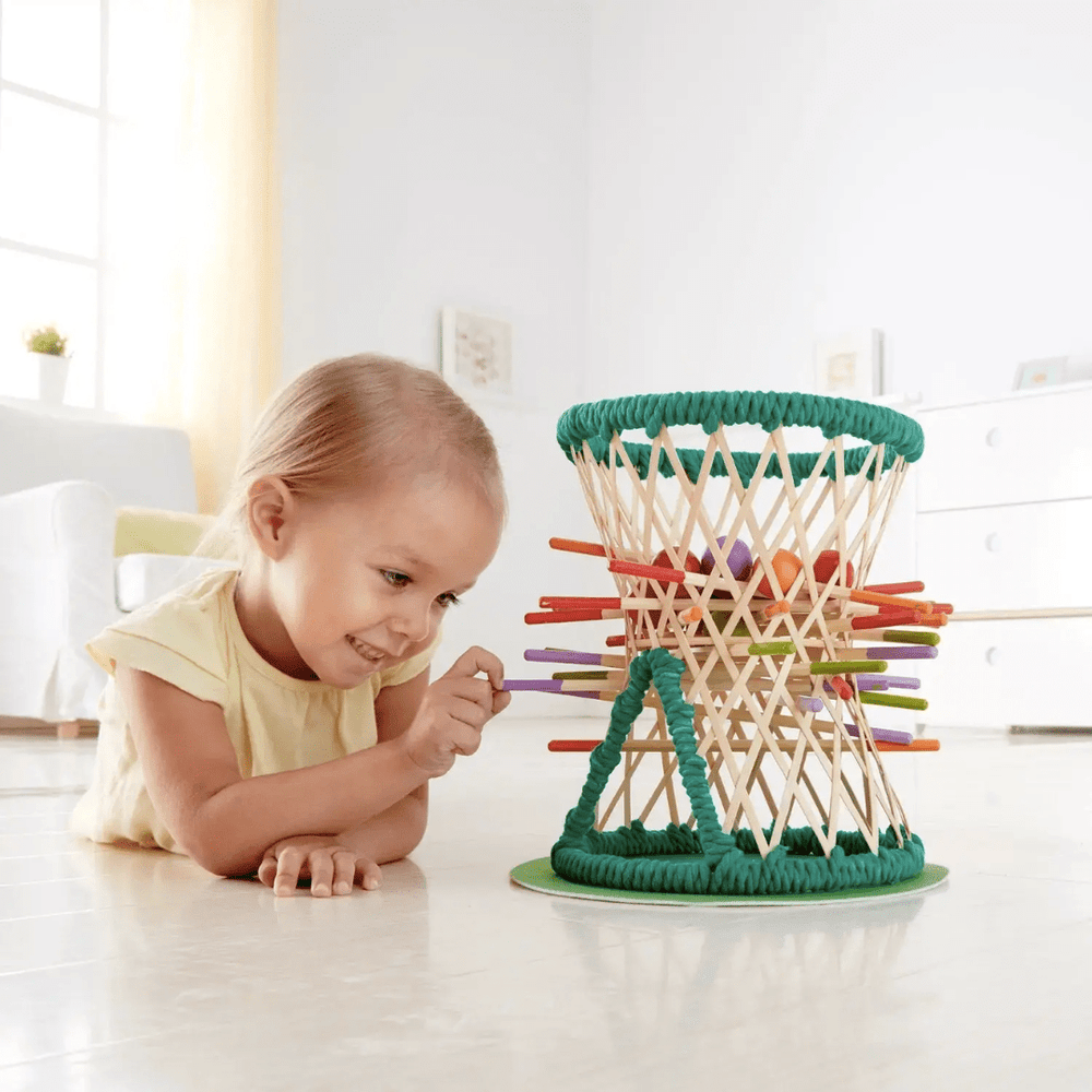 Little-Girl-Playing-With-Hape-Pallina-Original-Game-Naked-Baby-Eco-Boutique