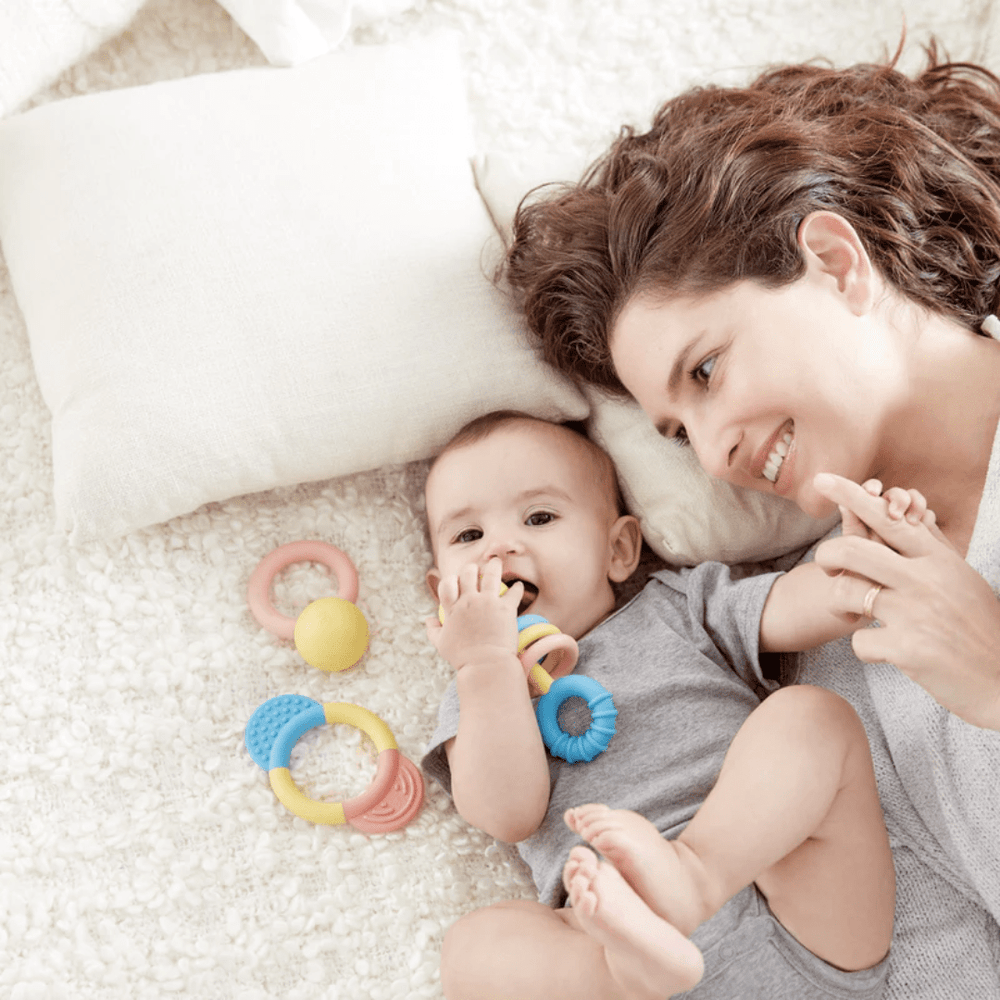 Mum-And-Baby-With-Hape-Rattle-And-Teether-Collection-Naked-Baby-Eco-Boutique