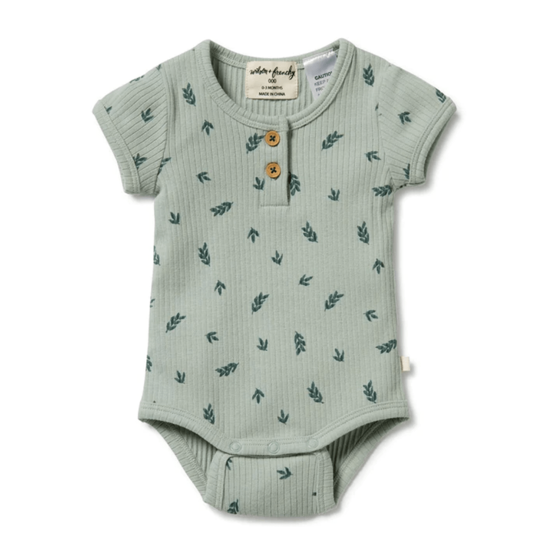 This Wilson & Frenchy outlet item features a Falling Leaf Organic Rib Henley onesie with green leaves printed on the short sleeve.