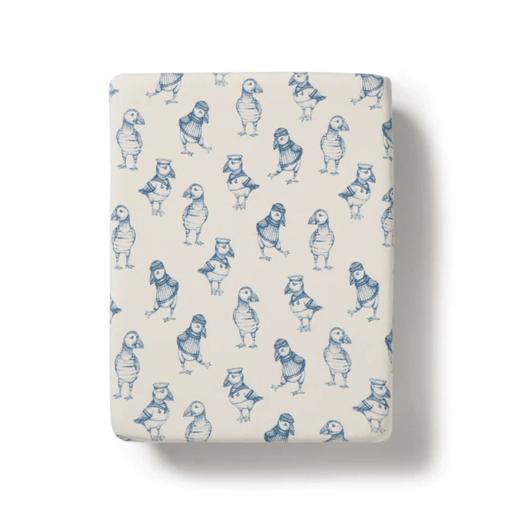 Top view of a Wilson & Frenchy Organic Cotton Bassinet Sheet - LUCKY LAST - HELLO JUNGLE ONLY with a repeated owl pattern.