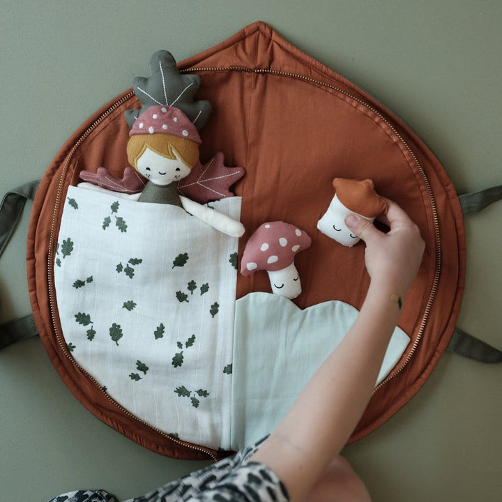 A child is holding a Fabelab Organic Cotton Play Purse in a bag.
