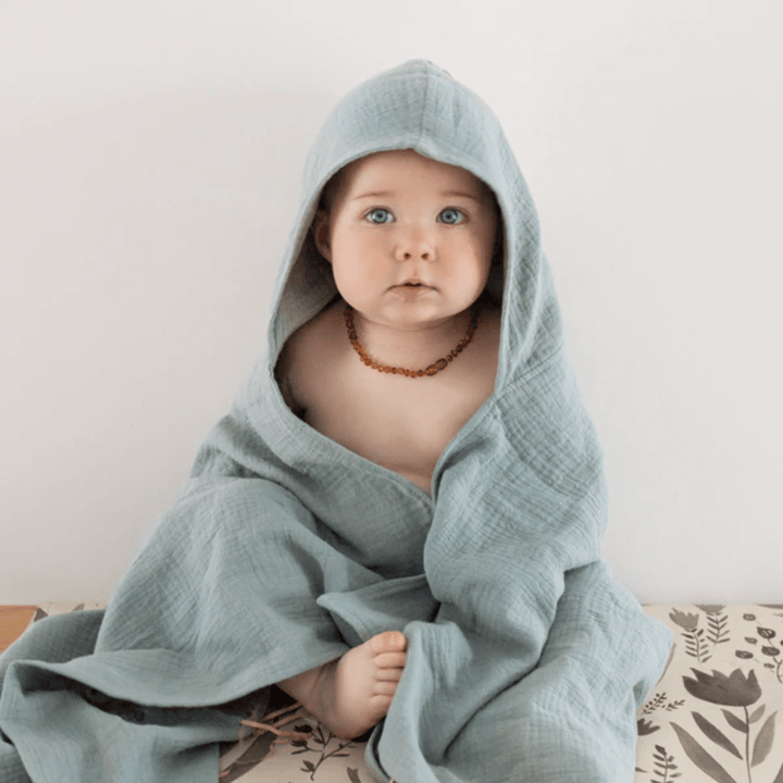 Over-The-Dandelions-Organic-Muslin-Hooded-Towel-Sage-On-Baby-Naked-Baby-Eco-Boutique