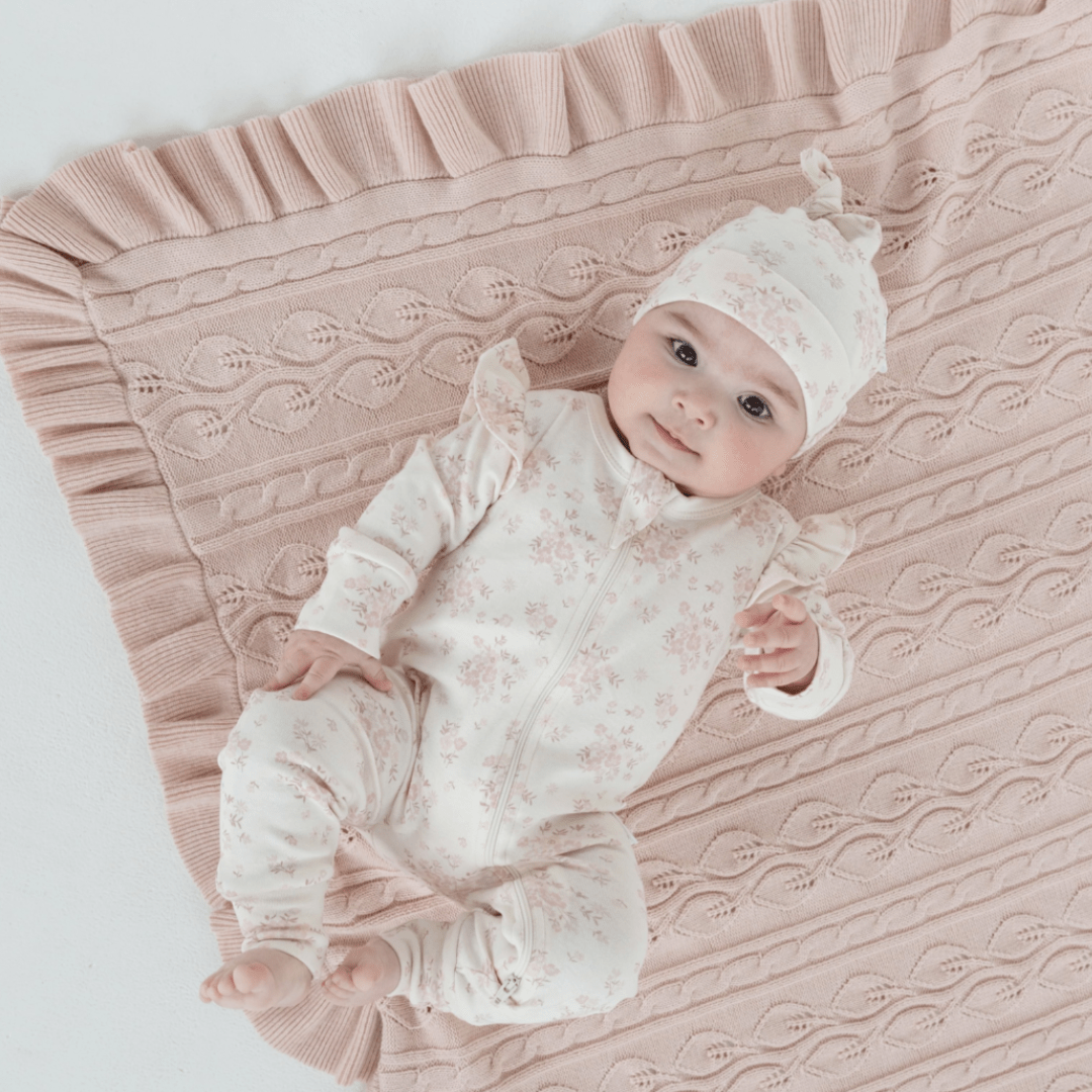Adorable-Baby-Lying-on-Aster-and-Oak-Organic-Ruffle-Cable-Knit-Baby-Blanket-Blush-Naked-Baby-Eco-Boutique