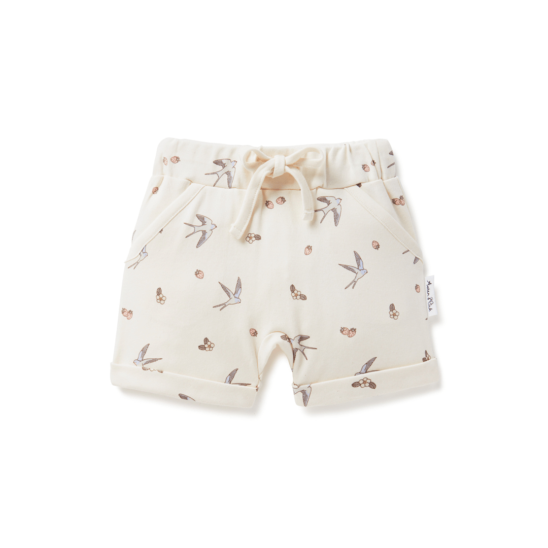 A baby's Aster & Oak Organic Cotton Harem Shorts with a bird print on organic cotton fabric and adjustable drawstring waist tie.