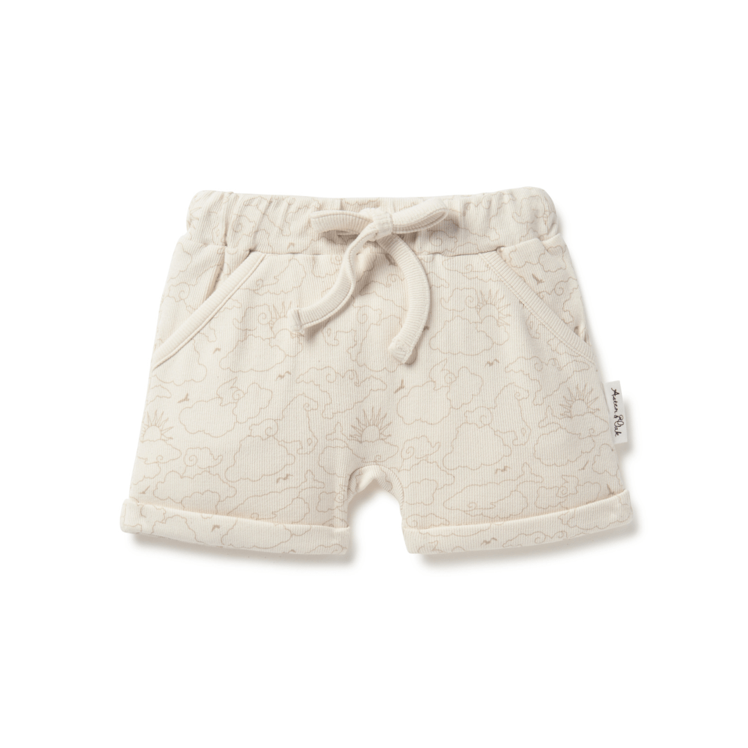 Cream coloured rib shorts for babies and kids, featuring a sun and cloud pattern, with cuffed legs, pockets, and a drawstring