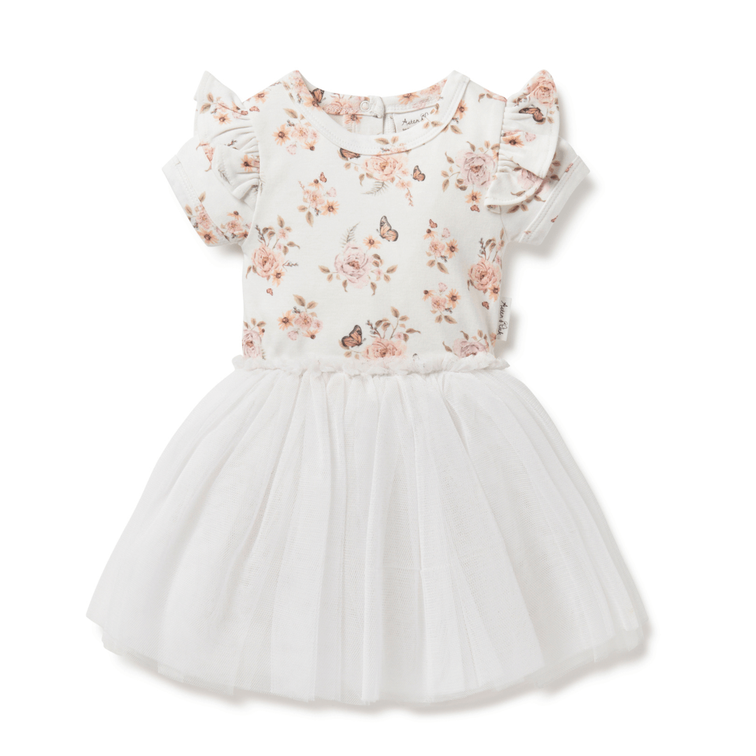 Beautiful tutu dress for babies and kids featuring a delicate hand-drawn monarch butterfly and flower print on the top half, short sleeves with a ruffle at the shoulder, and a tulle skirt