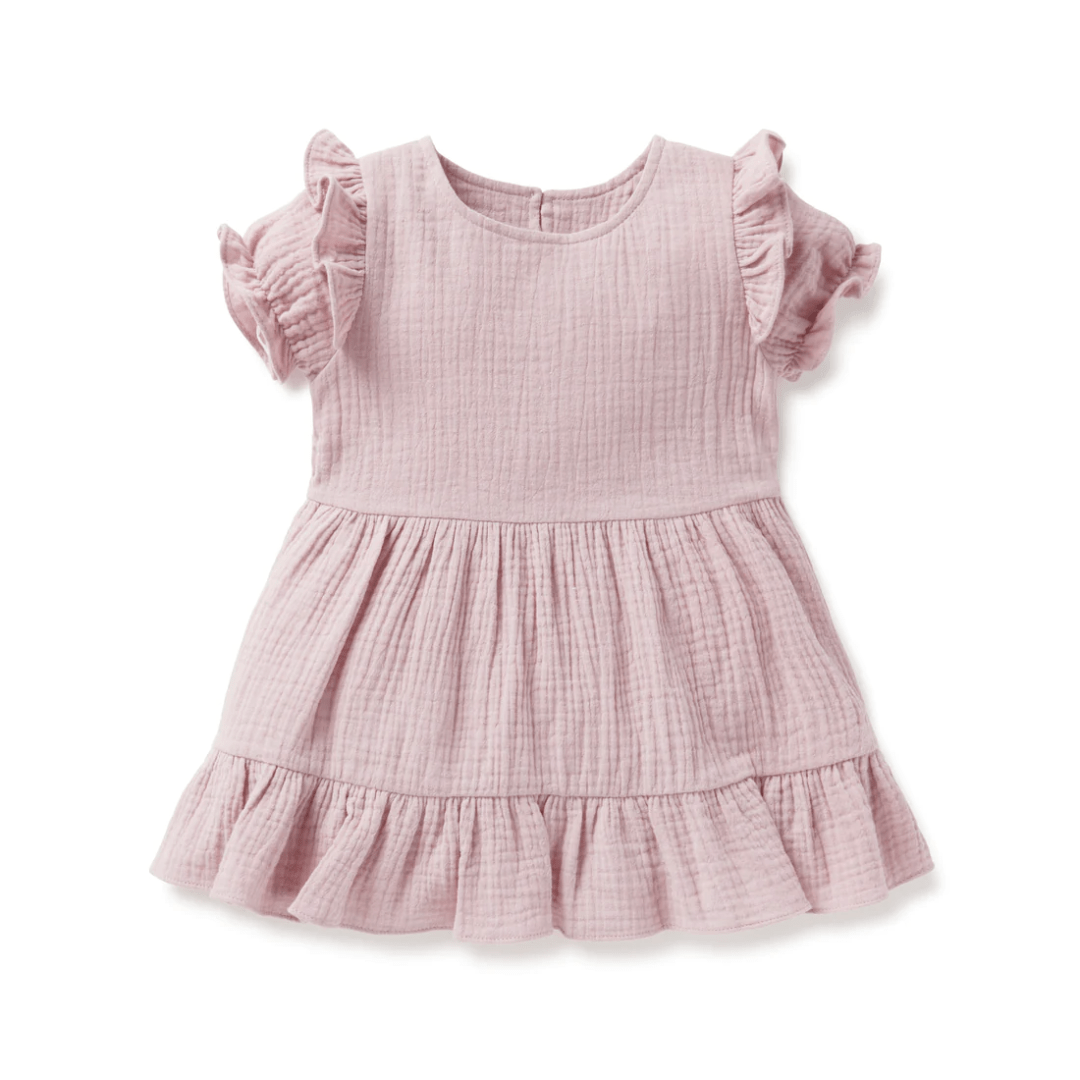 An Aster & Oak Organic Rosette Muslin Ruffle Dress in Lucky Lasts style with ruffled sleeves, for baby girls in pink color.