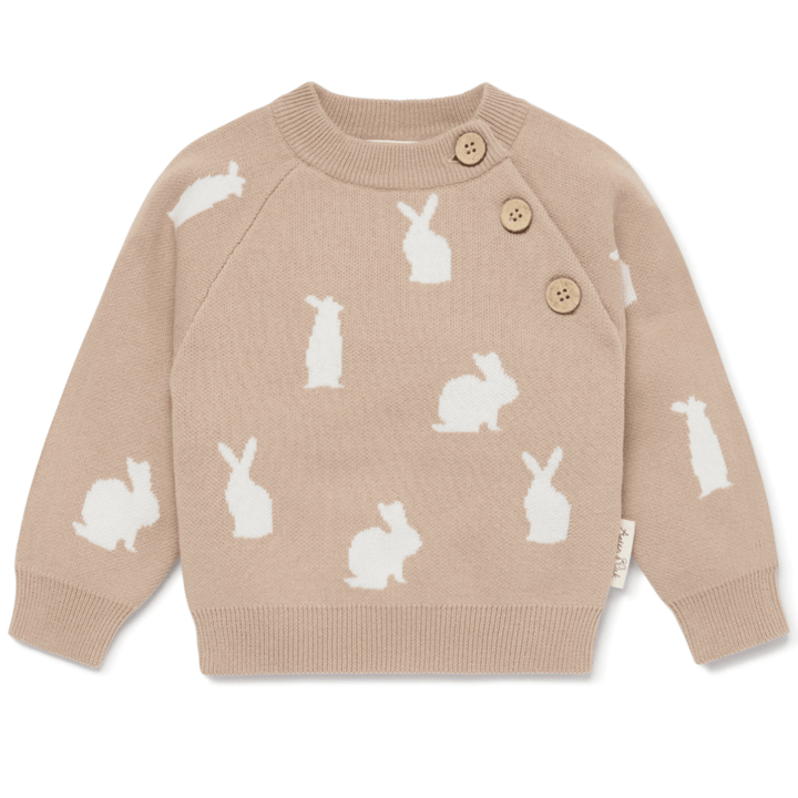 A beige Aster & Oak Organic Knit Bunny Jumper child's sweater with white rabbit patterns and button details on the shoulder, perfect for baby winter style.