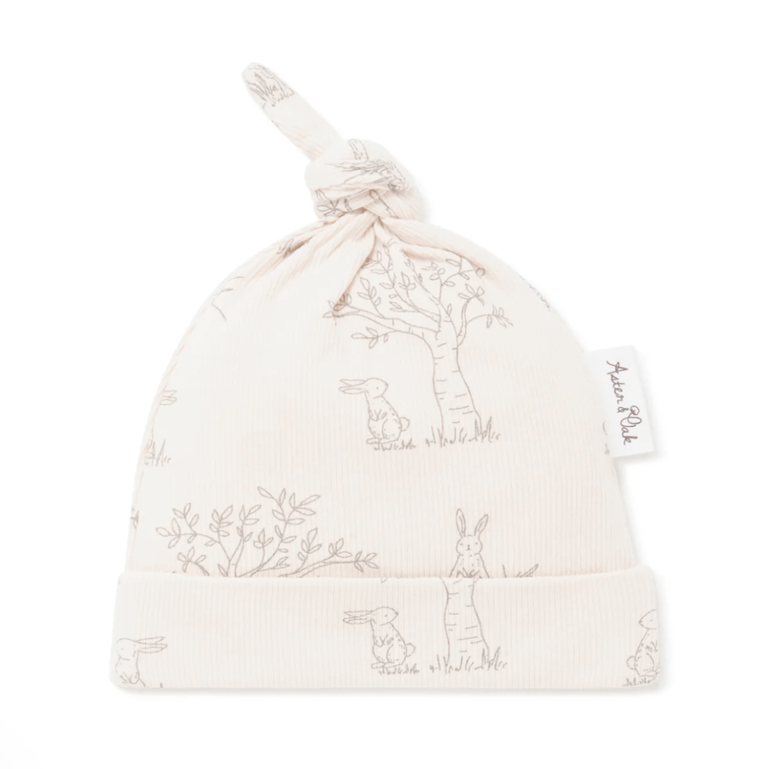 Baby's Aster & Oak Organic Bunny Luxe Rib Knot Hat with rabbit print and knotted design.