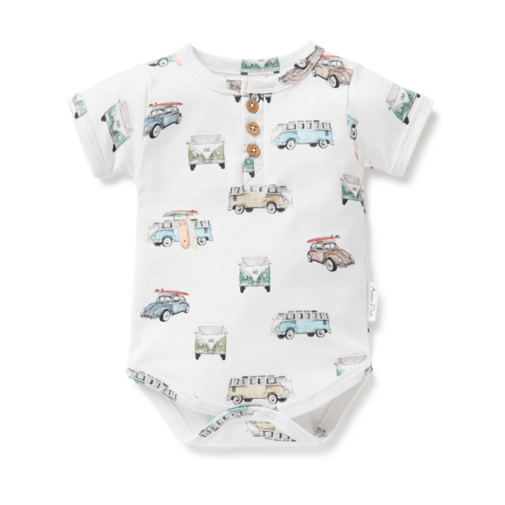 Aster & Oak Organic Cotton AOP Henley Onesie with vintage car print and front button detail.