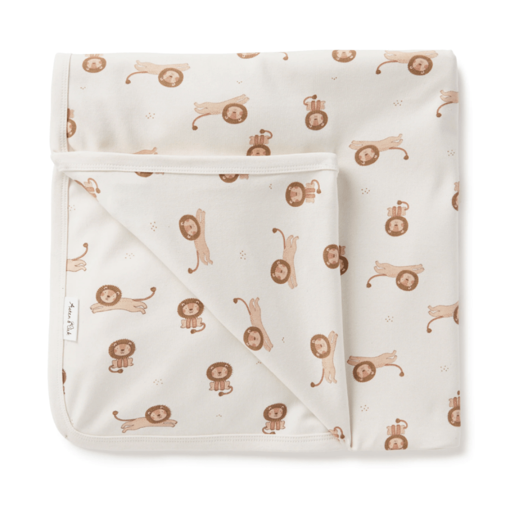 An Aster & Oak Organic Cotton Baby Swaddle Wrap, featuring brown lions on a white blanket.