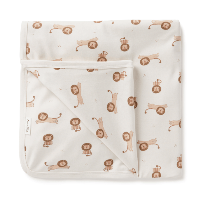 An Aster & Oak Organic Cotton Baby Swaddle Wrap, featuring brown lions on a white blanket.
