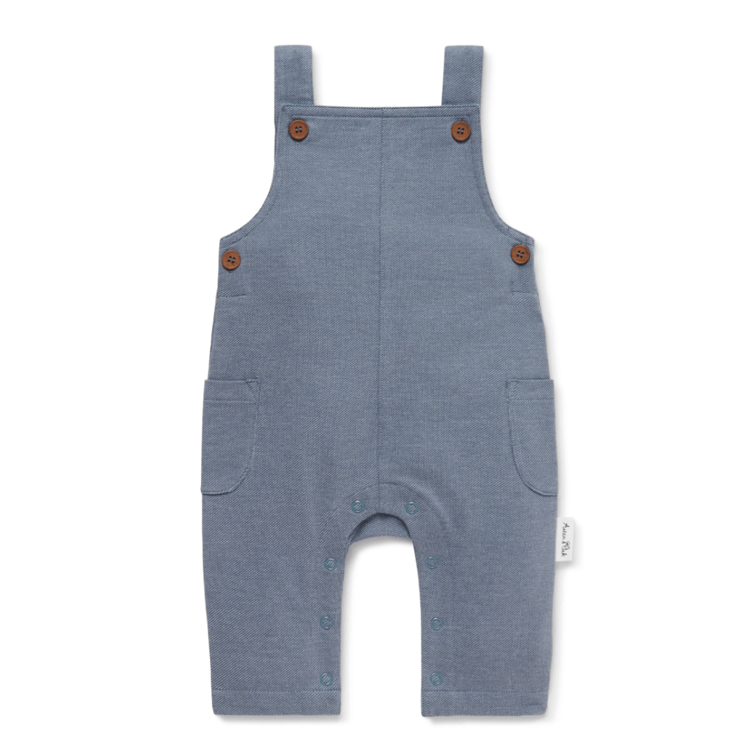 Aster & Oak Organic Dark Chambray Overalls isolated on a white background.