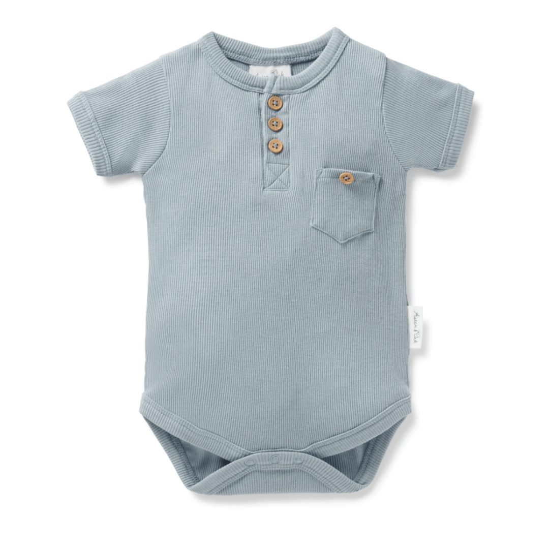 Baby's Aster & Oak blue short-sleeved organic cotton onesie with button details.