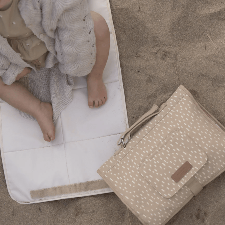 At-The-Beach-With-Storksak-Change-Station-Seashell-Naked-Baby-Eco-Boutique