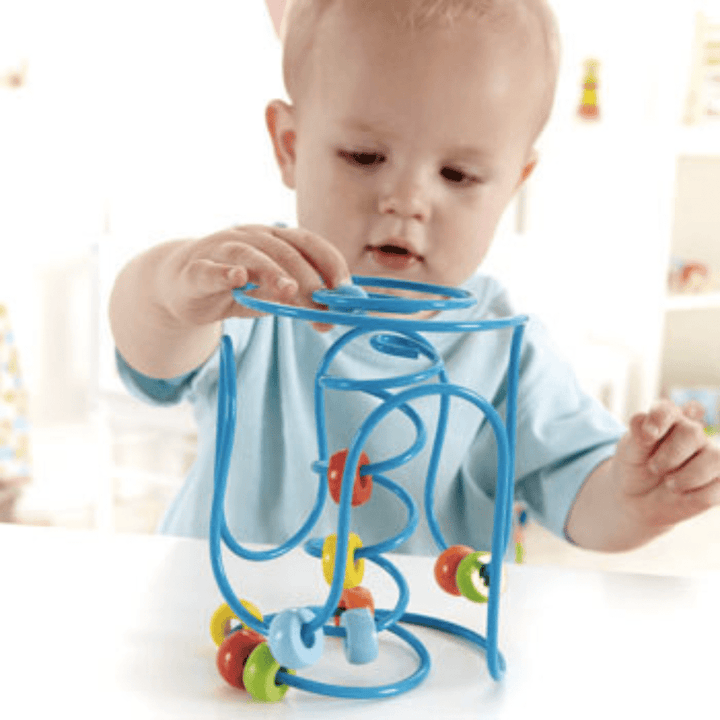 Baby-Moving-Blue-Bead-Around-On-Hape-Spring-A-Long-Bead-Maze-Naked-Baby-Eco-Boutique