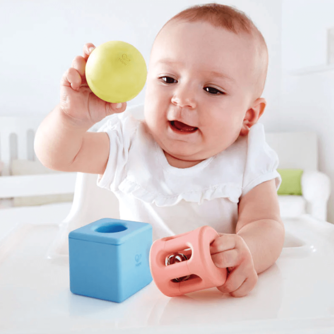 Baby-Playing-withHape-Geometric-Rattle-Naked-Baby-Eco-Boutique