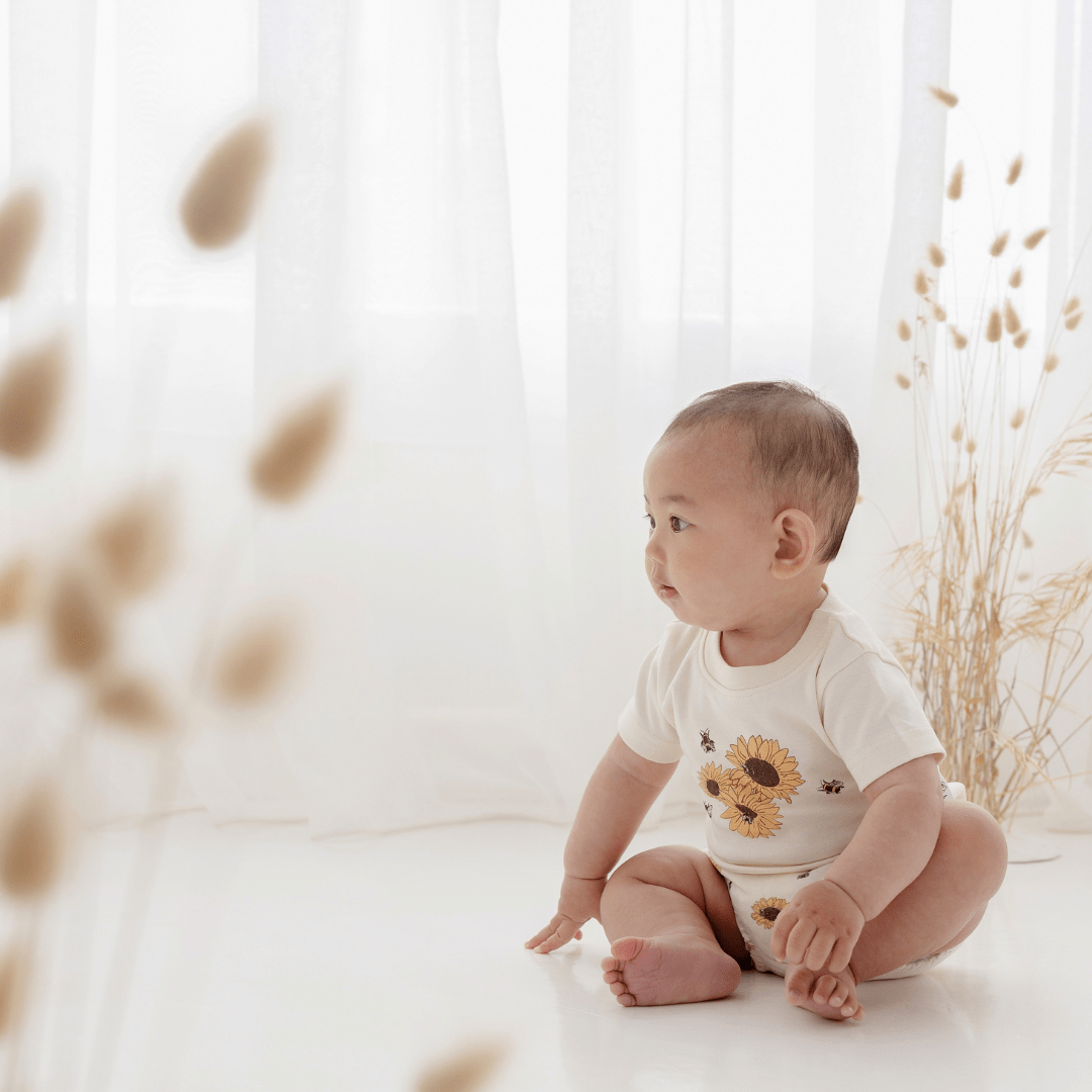 Baby-Sitting-Up-Wearing-Aster-And-Oak-Organic-Cotton-Print-Top-Sunflower-Naked-Baby-Eco-Boutique
