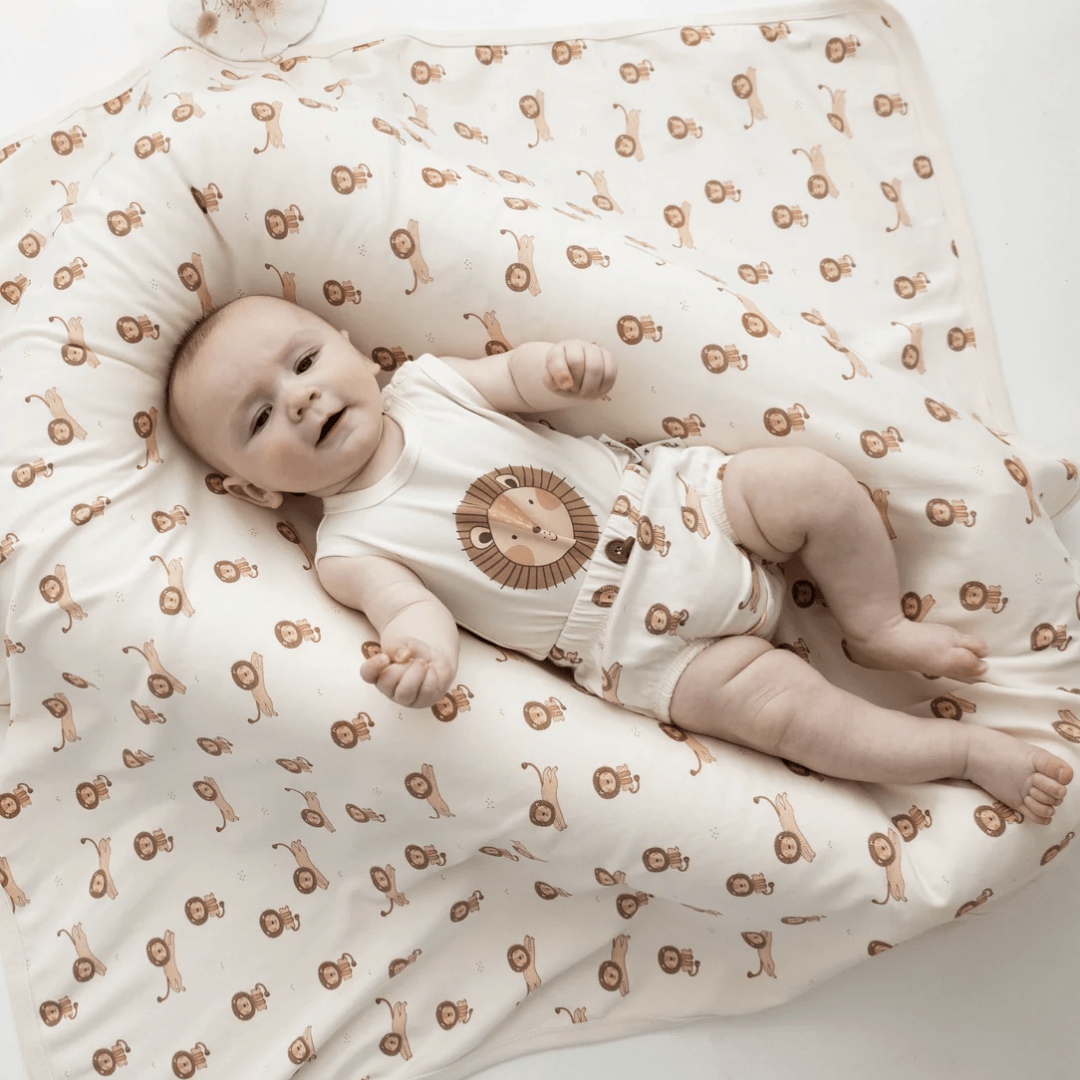 Baby-With-Matching-Swaddle-And-Aster-And-Oak-Organic-Lion-Print-Singlet-Onesie-Naked-Baby-Eco-Boutique