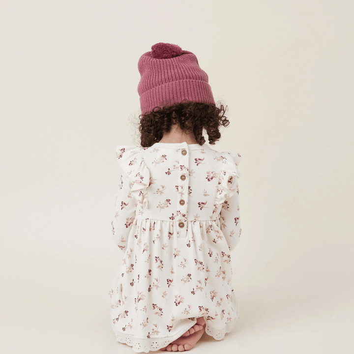 Back-View-of-Child-Kneeling-Wearing-Aster-and-Oak-Organic-Cotton-PomPom-Beanie-Berry-Naked-Baby-Eco-Boutique