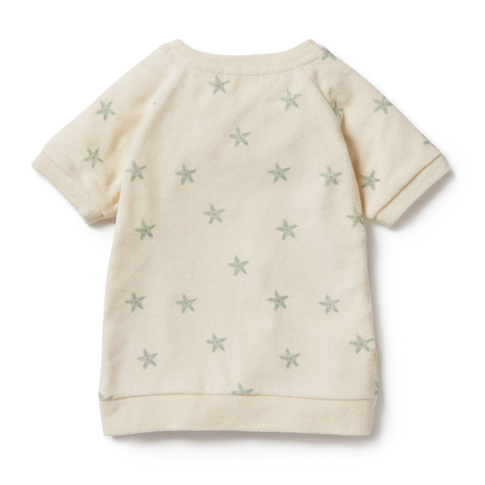 A Wilson & Frenchy Tiny Starfish Organic Terry Kids Sweat Top with stars on it.