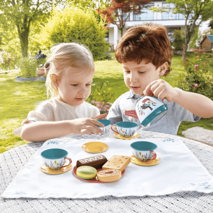 Boy-And-Girl-Having-A-Tea-Party-Outside-With-Hape-Teatime-Playset-Naked-Baby-Eco-Boutique
