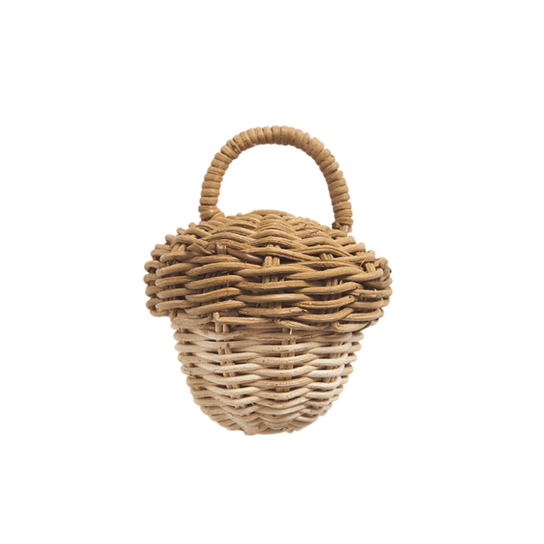 A Classical Child rattan wicker basket with handles on a white background.