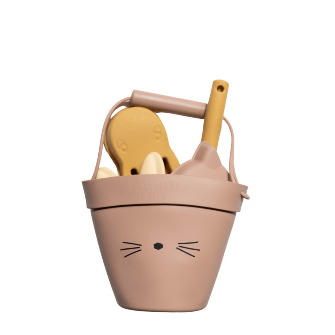 An eco-friendly Classical Child beige bucket with a cat face on it, perfect for beach toys.