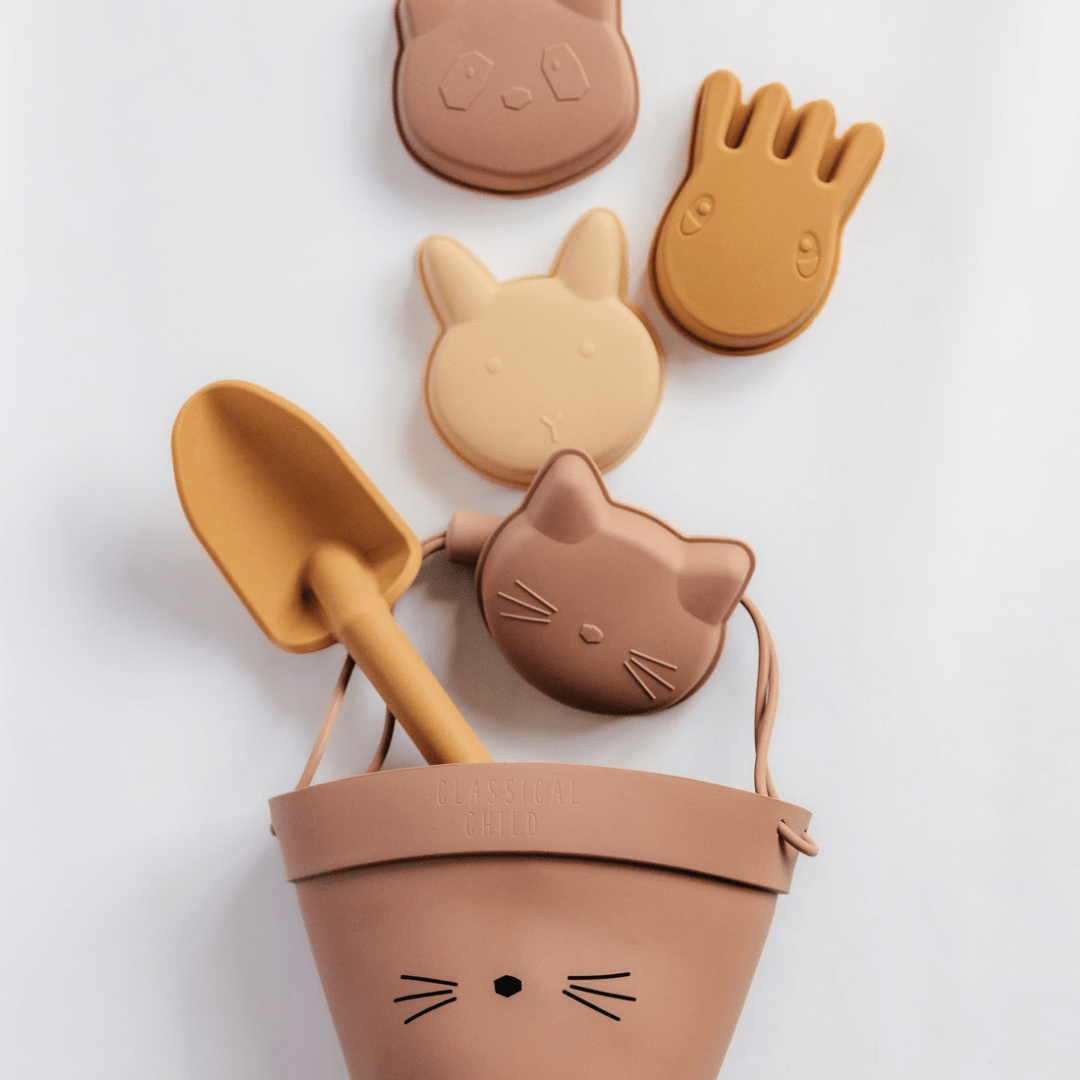 An eco-friendly Classical Child Silicone Sand Set with cat shaped toys and a shovel.