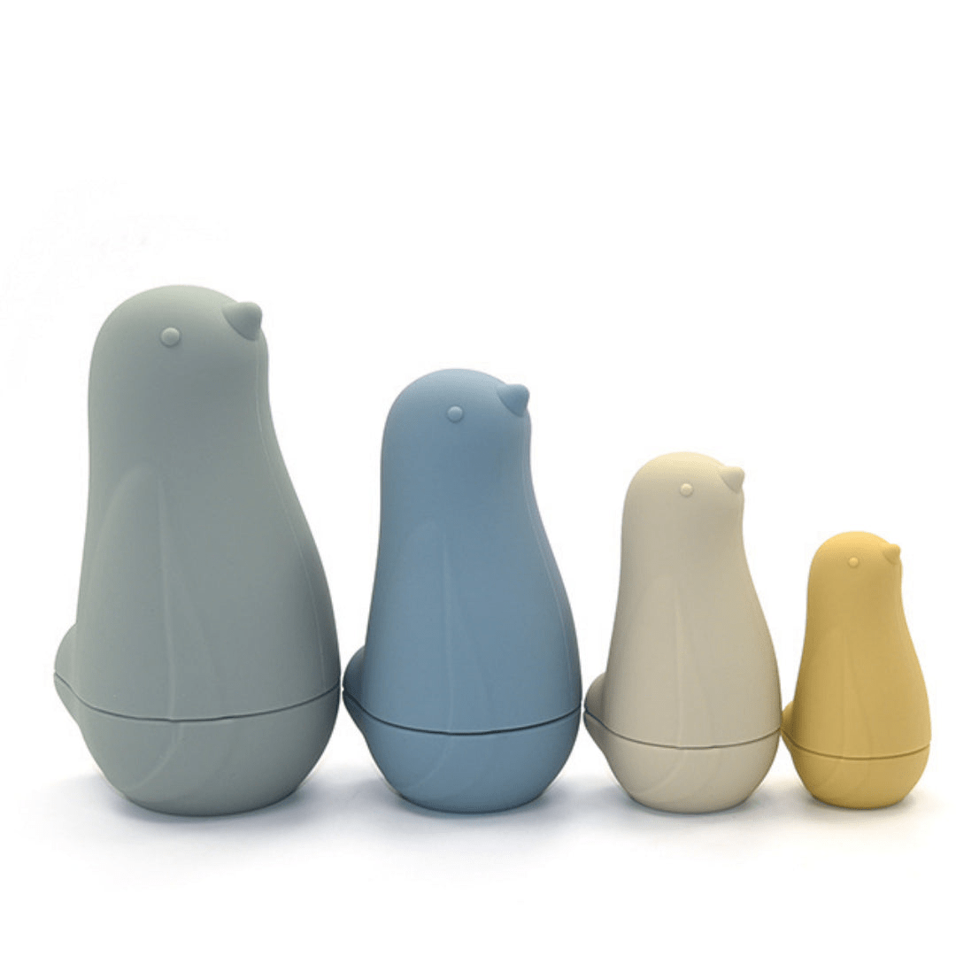 A group of durable Classical Child Silicone Stacking Dolls are standing next to each other.
