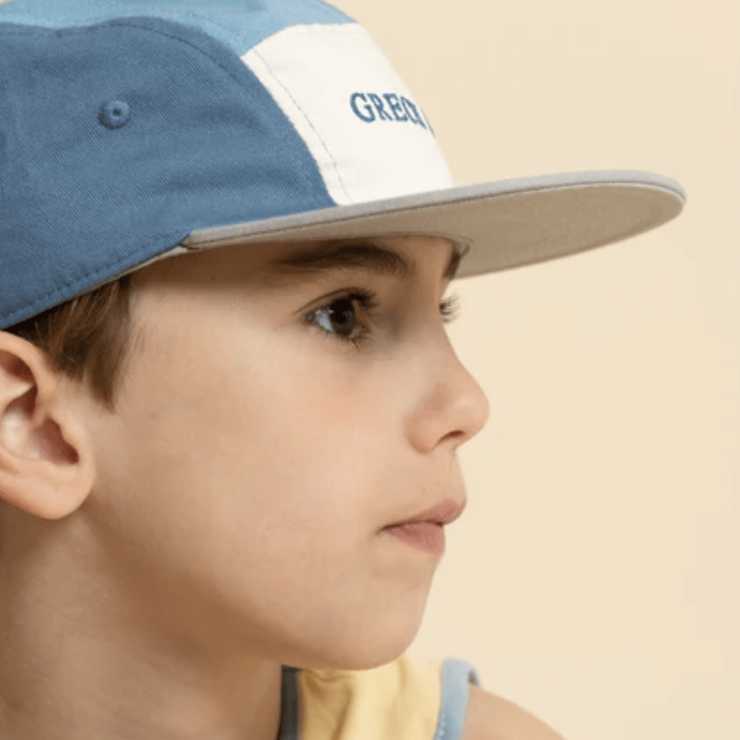 Close-Up-Of-Boy-Wearing-Grech-And-Co-Organic-Anti-UV-5-Panel-Hat-Sky-Blue-Desert-Naked-Baby-Eco-Boutique