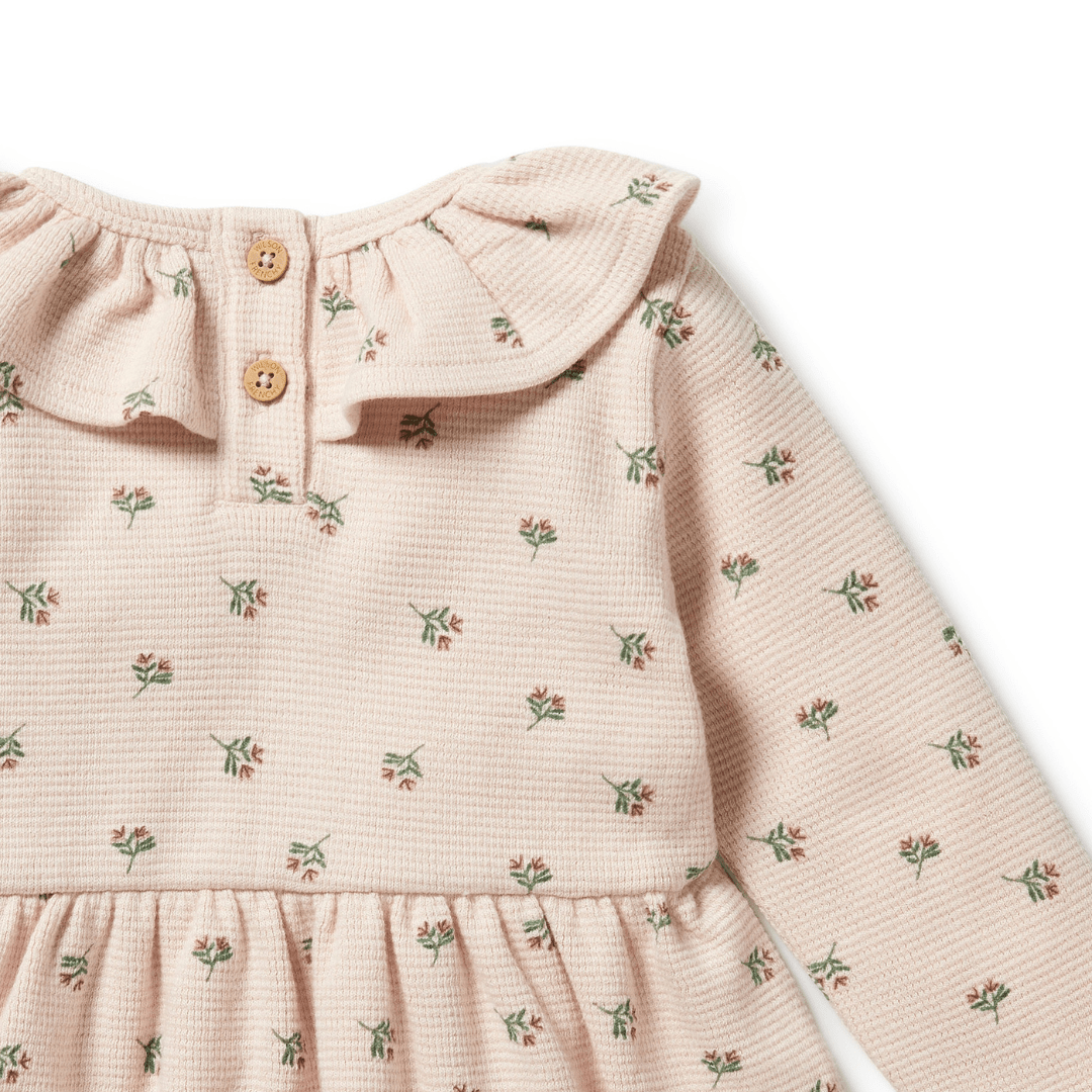 Close-Up-Of-Buttons-On-The-Back-Of-Wilson-And-Frenchy-Organic-Waffle-Long-Sleeved-Ruffle-Dress-Emily-Floral-Naked-Baby-Eco-Boutique