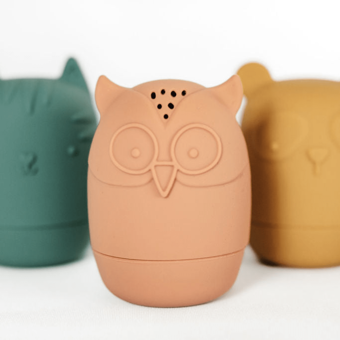 A group of Classical Child owl shaped mugs on a white surface, perfect for fine motor skills.
