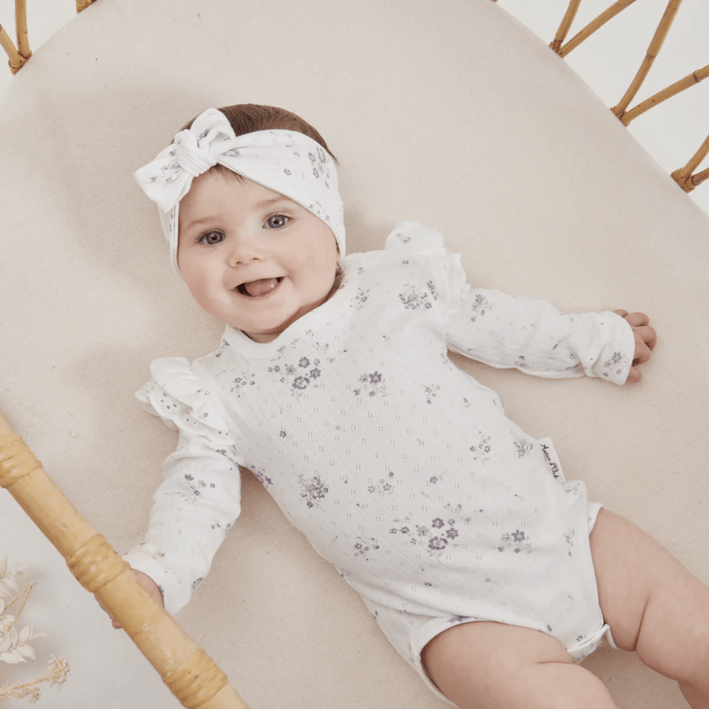 Close-Up-Of-Happy-Baby-Wearing-Aster-And-Oak-Organic-Grace-Floral-Flutter-Onesie-Naked-Baby-Eco-Boutique