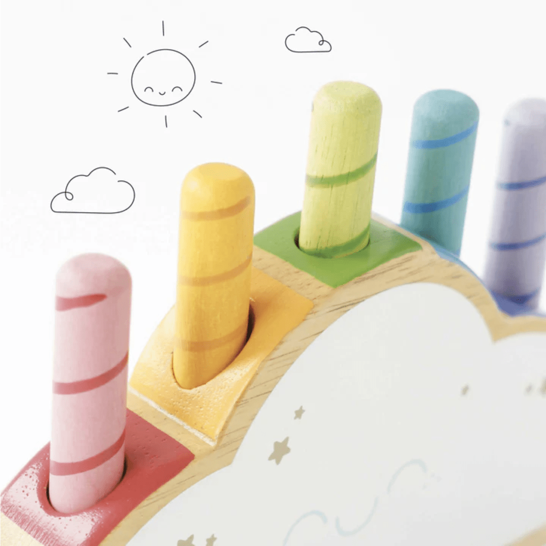 An eco-friendly Le Toy Van wooden toy with a Le Toy Van Rainbow Pop Cloud on top.