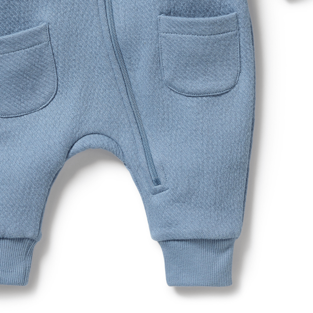 Close-Up-Of-Leg-And-Zip-On-Wilson-And-Frenchy-Organic-Quilted-Growsuit-Storm-Blue-Naked-Baby-Eco-Boutique