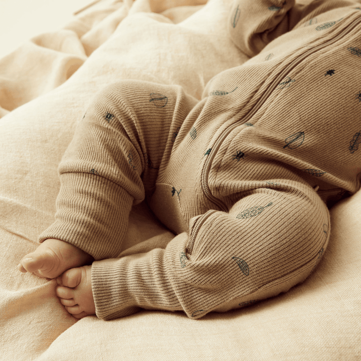 Close-Up-Of-Little-Toes-Baby-Wearing-Wilson-And-Frenchy-Organic-Rib-Baby-Pyjamas-Jungle-Leaf-Naked-Baby-Eco-Boutique