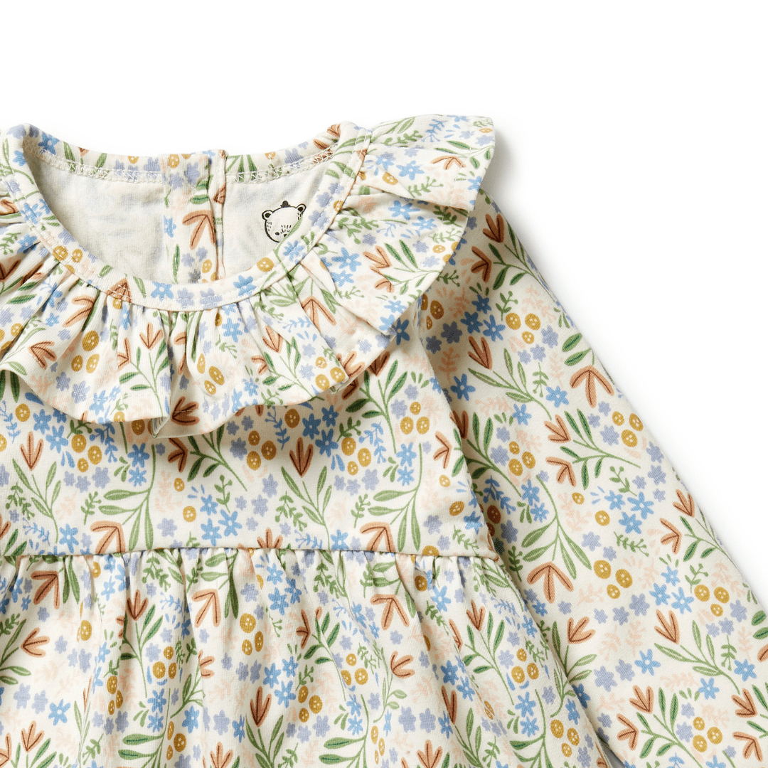 Close-Up-Of-Neck-Ruffle-On-Wilson-And-Frenchy-Organic-Long-Sleeved-Ruffle-Dress-Tinker-Floral-Naked-Baby-Eco-Boutique