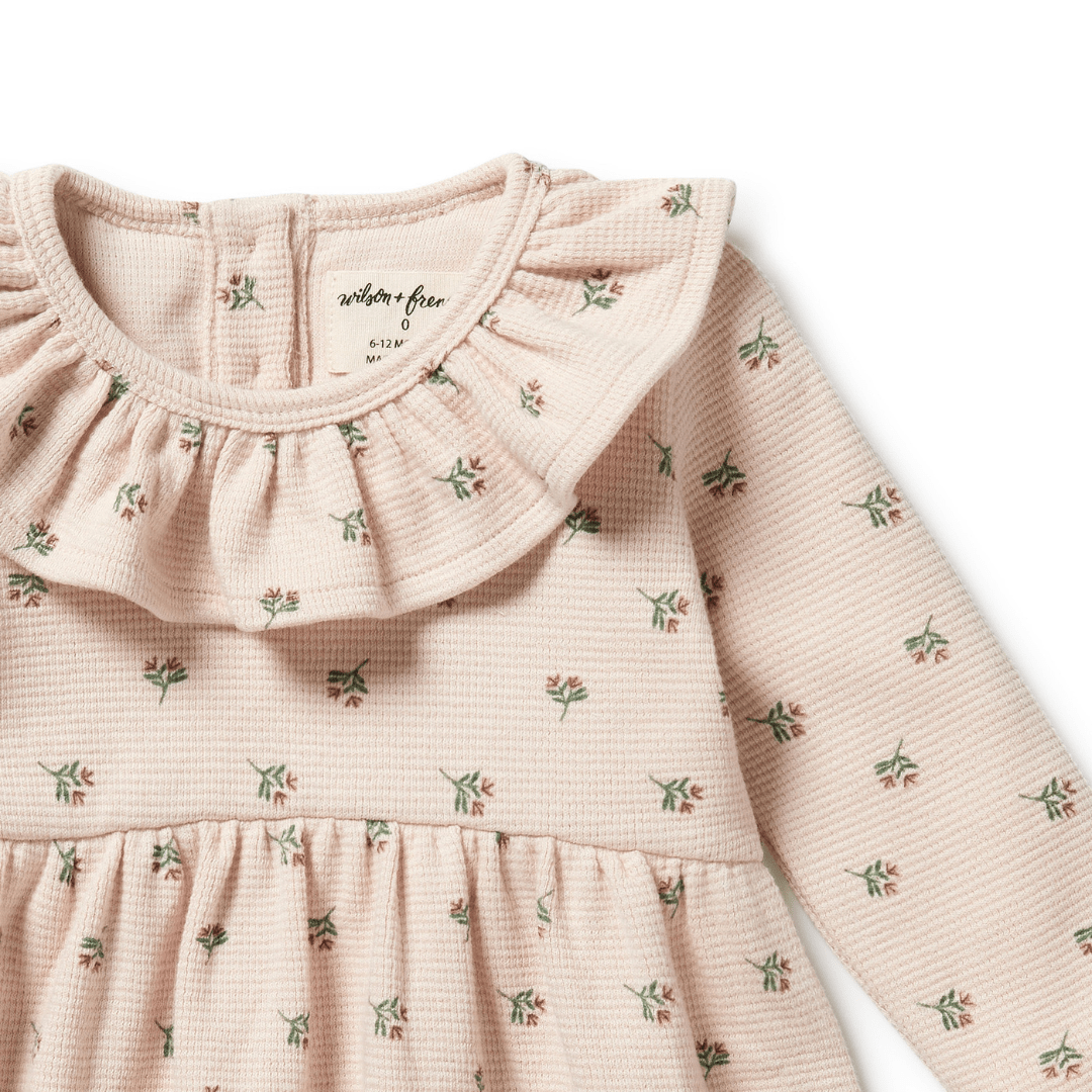 Close-Up-Of-Neck-Ruffle-On-Wilson-And-Frenchy-Organic-Waffle-Long-Sleeved-Ruffle-Dress-Emily-Floral-Naked-Baby-Eco-Boutique