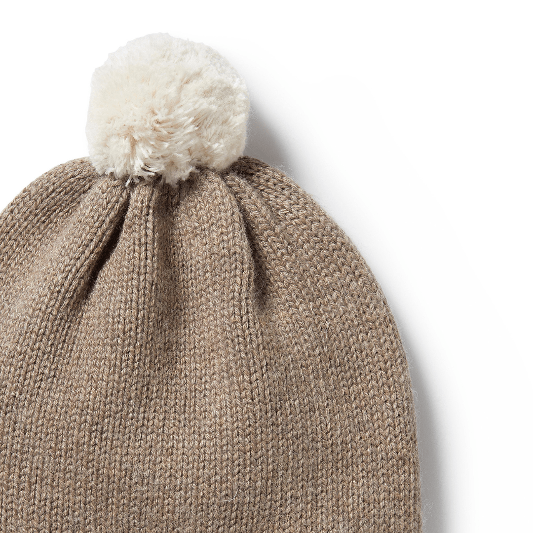Wilson & Frenchy beige stripe knit hat with a white pom-pom on top.