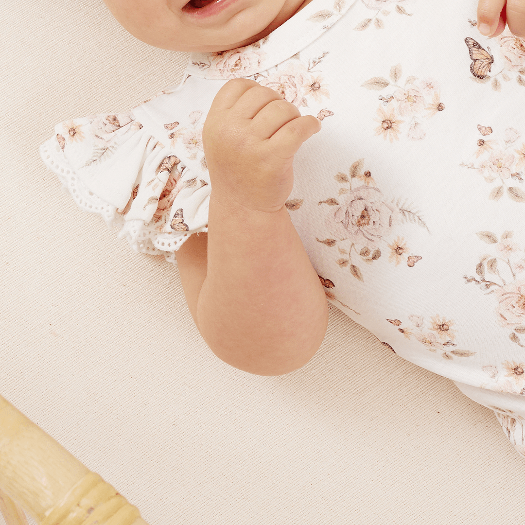 Close-Up-Of-Print-On-Aster-And-Oak-Organic-Cotton-Butterfly-Lace-Onesie-Naked-Baby-Eco-Boutique