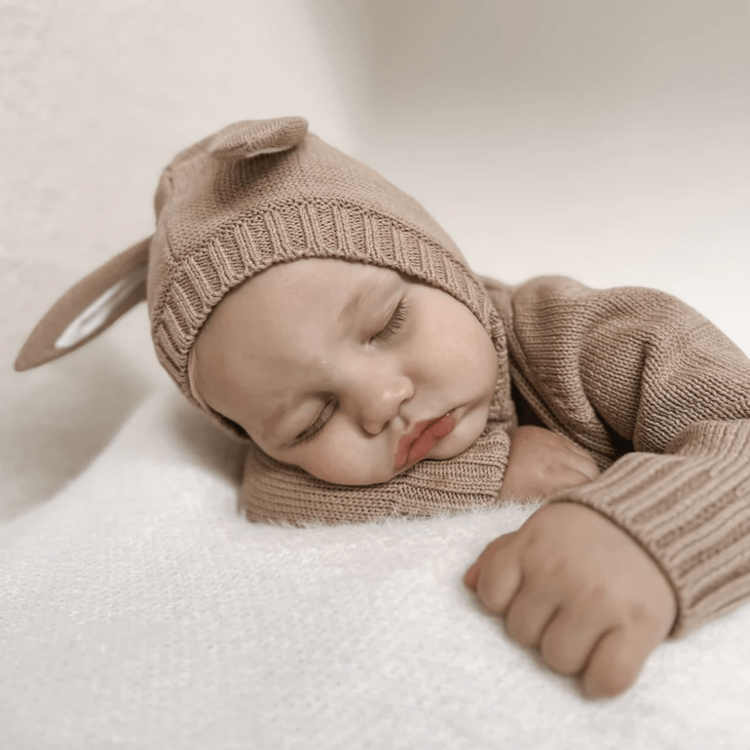 Close-Up-Of-Sleeping-Baby-Wearing-Aster-And-Oak-Organic-Bunny-Knit-Romper-Taupe-Naked-Baby-Eco-Boutique